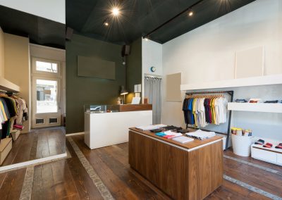 Interior of modern urban fashion clothes t-shirt store