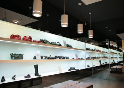 shelfs in store with bags and shoes