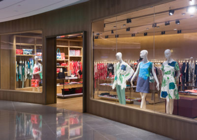 Boutique display window with mannequins in fashionable dresses